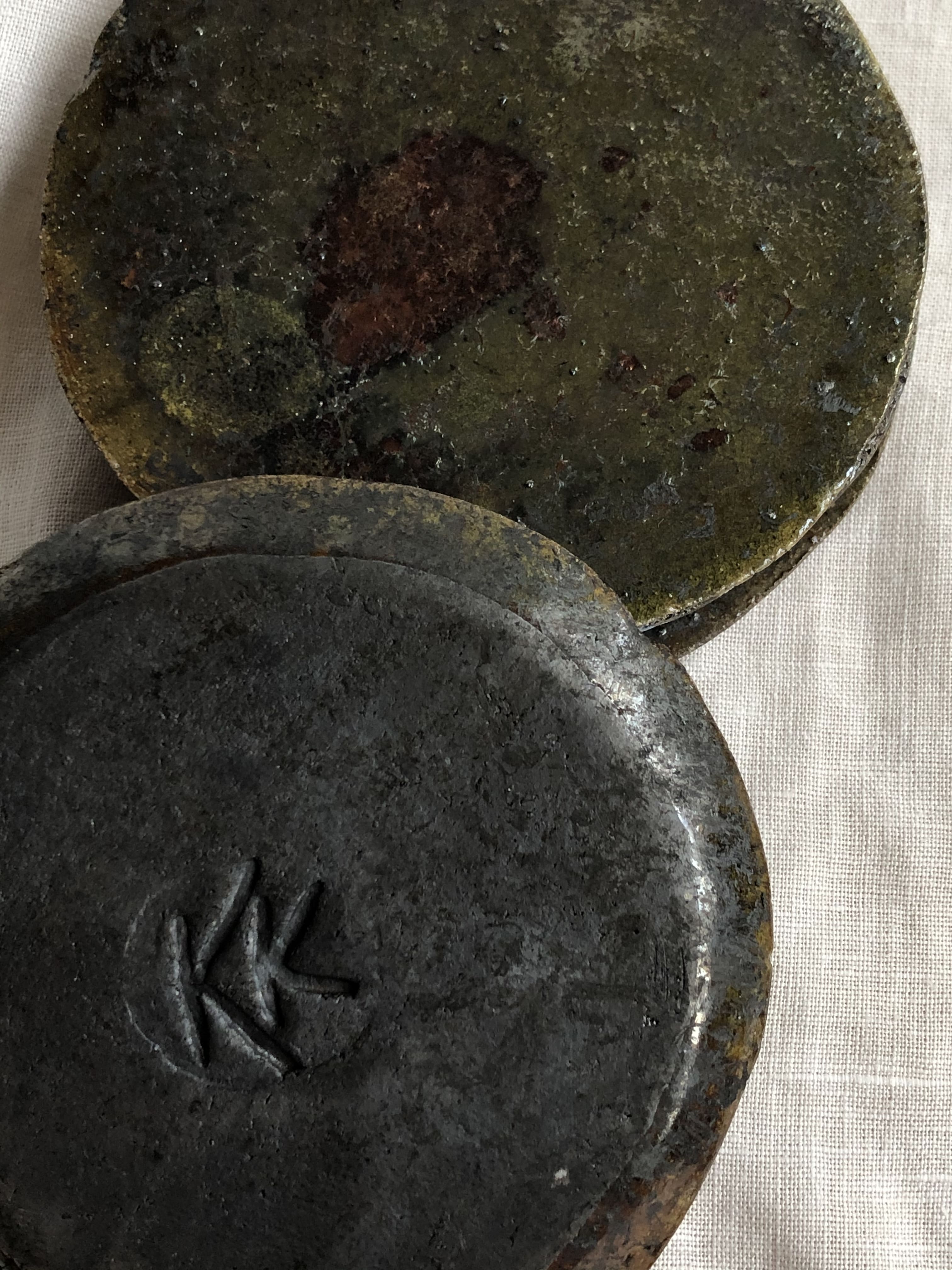 two ceramic coasters